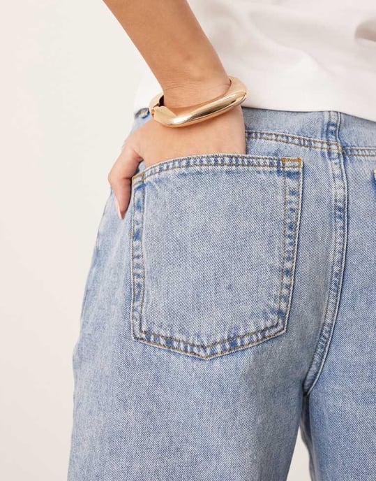 ARRANGE Cleo denim longline short with raw hem in mid wash blue - Image 4