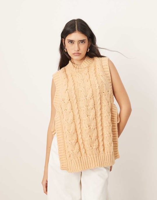 ARRANGE cable knit sleeveless jumper with tie detail in apricot - Image 1