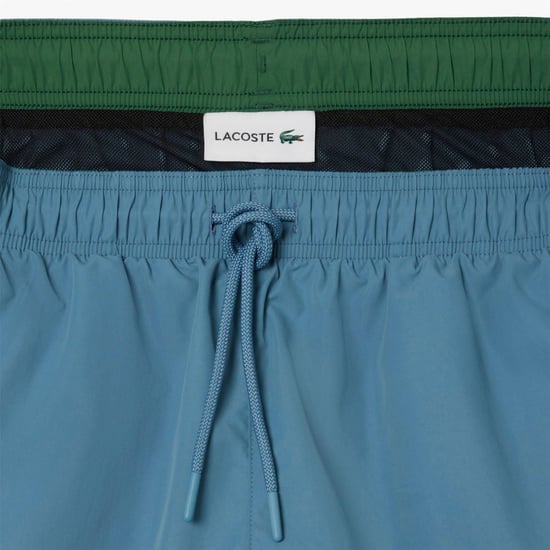 Men's Lacoste Length Monochrome Swim Trunks in Blue - Image 6