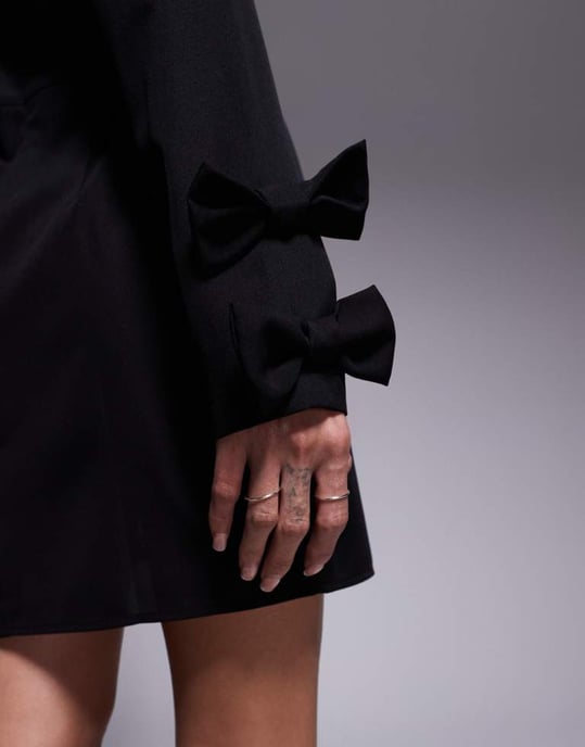 In The Style x Perrie Sian exclusive structured long sleeve bow detail mini dress in black - Image 4