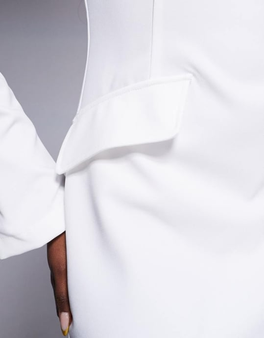 In The Style x Natalya Wright exclusive tailored high neck long sleeve mini dress with pocket detail in white - Image 4