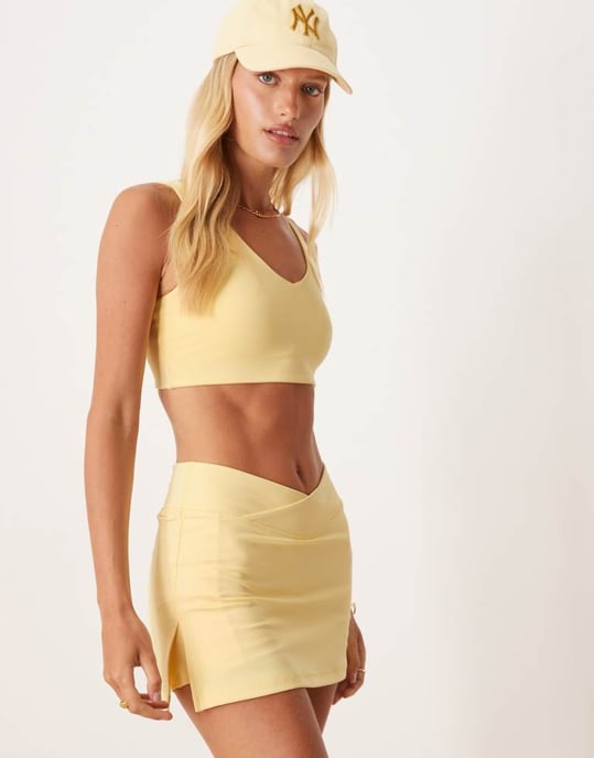 4505 wrap waist tennis skirt with under short and phone pocket in pale yellow - Image 4