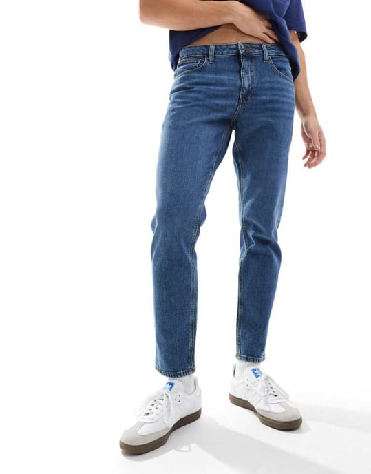 ASOS DESIGN stretch tapered jeans in dark wash blue - Image 1