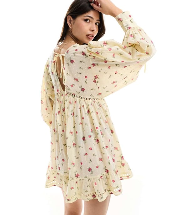 ASOS DESIGN Lace trim playsuit with full flippy shorts in ditsy print - Image 4