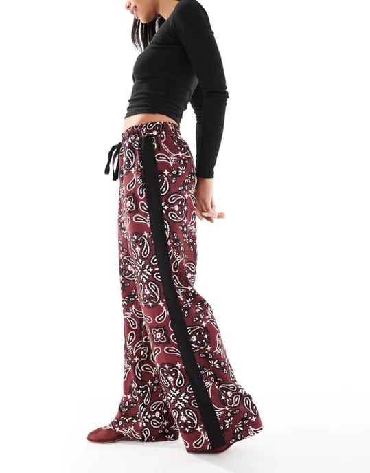 ASOS DESIGN pull on trousers with contrast panel in dark cherry bandana print - Image 1