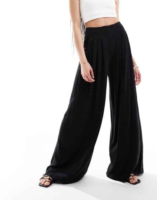 ASOS DESIGN Lång plisserad palazzo byxa med vida ben i linne i svart - Image 3