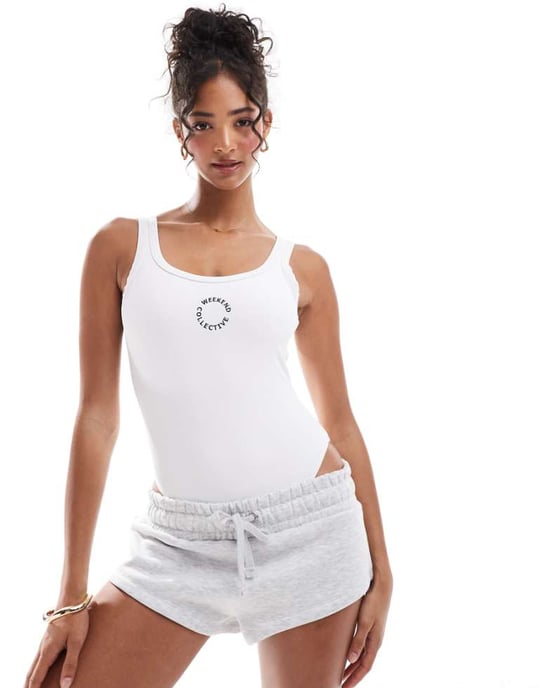 ASOS Weekend Collective baddräkt med öppen rygg och broderad logotyp i vit ribbstruktur - Image 1