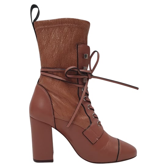 Stuart Weitzman Veruka Lace-Up Ankle Boots in Rose Pink Leather - Image 1
