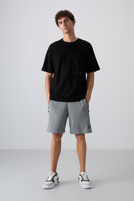 Överdimensionerad T-shirt i bomullsblandning med rund hals och ficka - Image 2