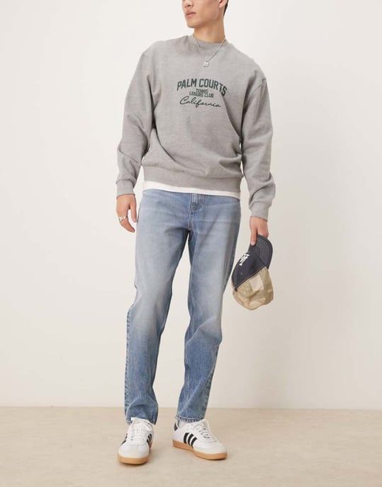 ASOS DESIGN tapered jeans in mid wash blue - Image 1