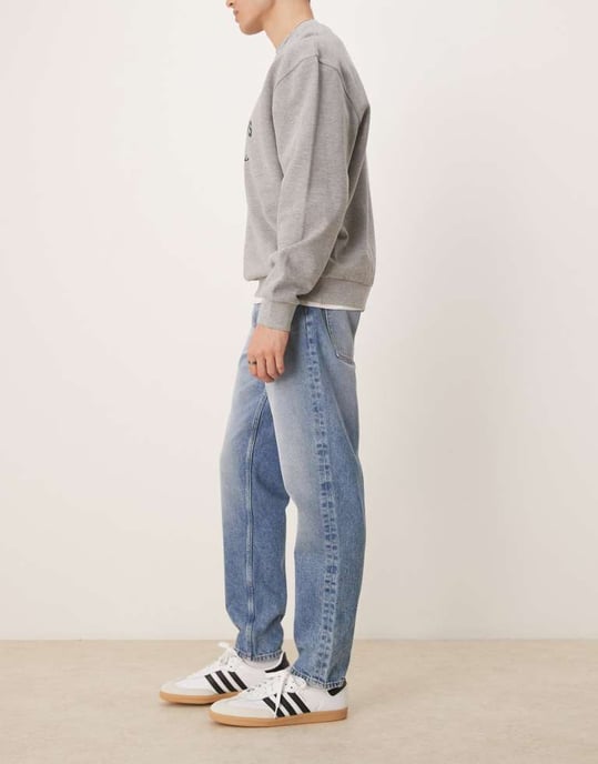 ASOS DESIGN tapered jeans in mid wash blue - Image 2