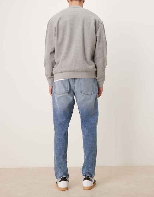 ASOS DESIGN tapered jeans in mid wash blue - Image 3