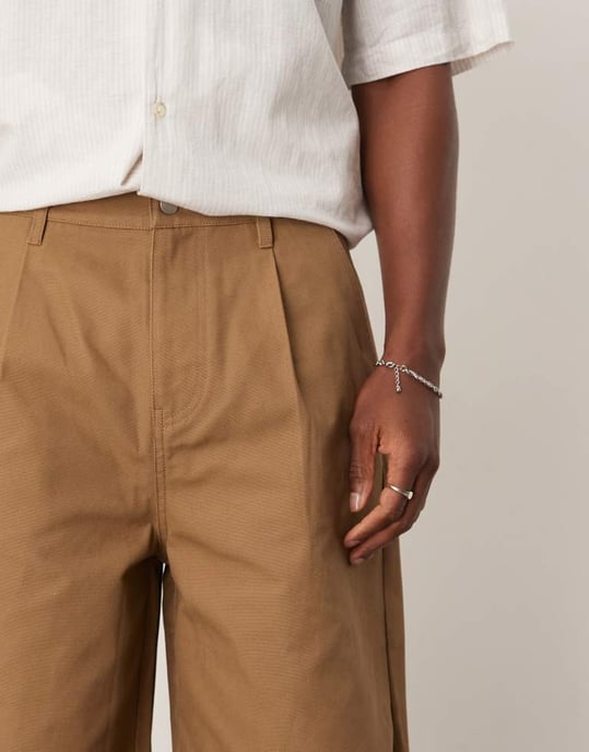 ASOS DESIGN long length pleated shorts in tan - Image 4