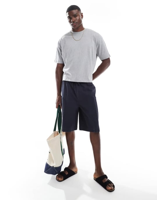 ASOS DESIGN long length canvas cargo shorts in washed navy - Image 1