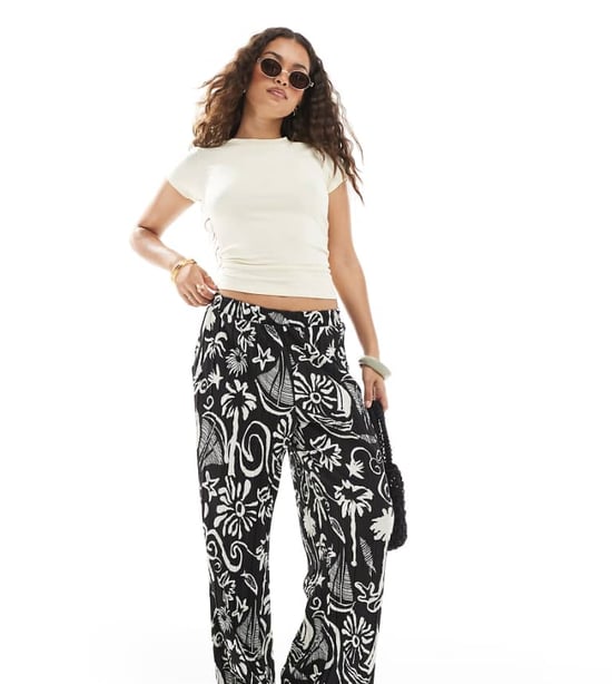 Vero Moda Petite high waist wide leg plisse trouser in tropical conversational print - Image 1