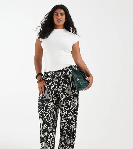 Vero Moda Curve high waist wide leg plisse trouser in tropical conversational print - Image 1