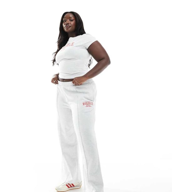 ASOS DESIGN Curve straight leg jogger with Marseille embroidered graphic in ice marl - Image 1