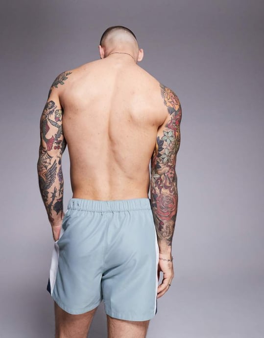 ASOS DESIGN swim shorts in short length with side vent cut and sew in blue - Image 4