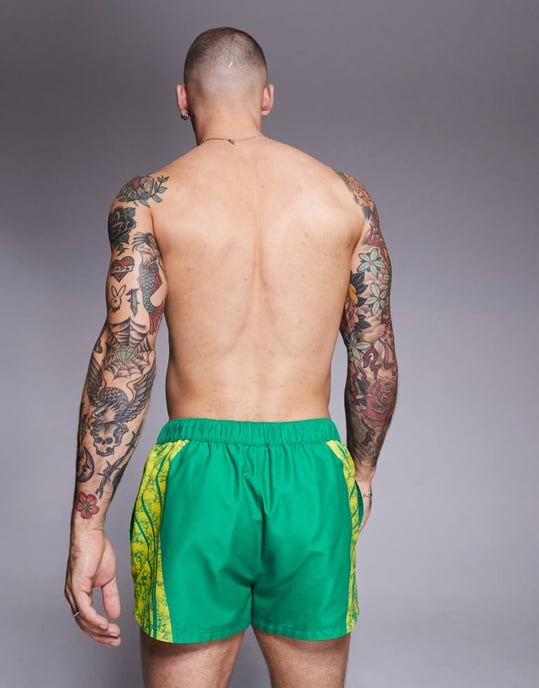 ASOS DESIGN swim shorts in super short length with placement animal print in green - Image 3