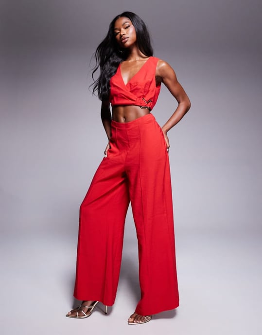 ASOS DESIGN wrap front cut out jumpsuit with buckle detail in red - Image 1
