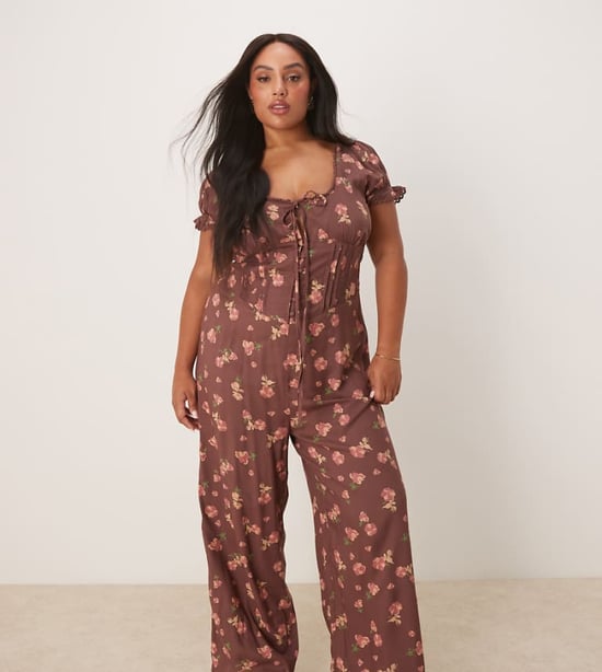 ASOS DESIGN Curve spun lace trim corset waist jumpsuit in mauve floral print - Image 1