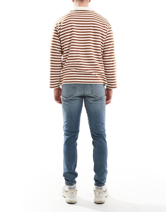 ASOS DESIGN skinny jeans in mid wash blue - Image 2