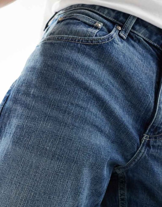 ASOS DESIGN stretch tapered jeans in light wash blue - Image 3