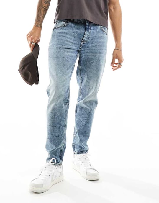 ASOS DESIGN stretch tapered jeans in mid wash blue - Image 3