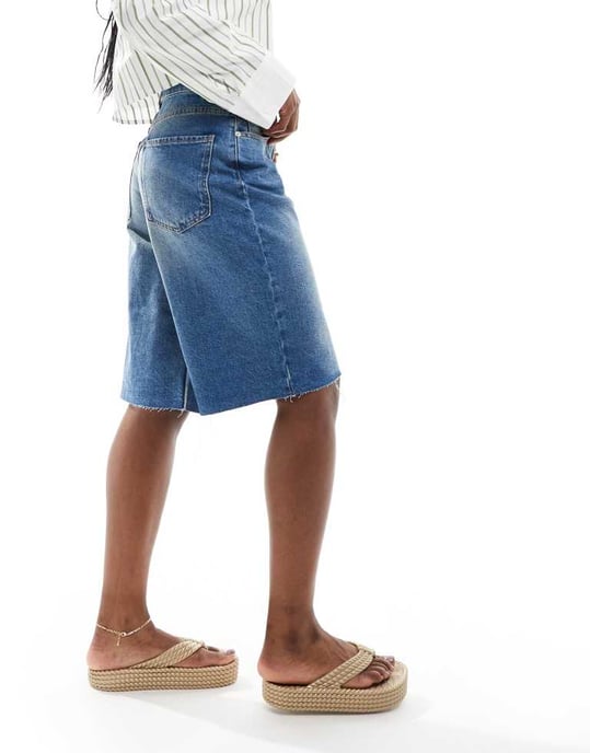 ASOS DESIGN baggy longline denim jorts in midwash blue - Image 4