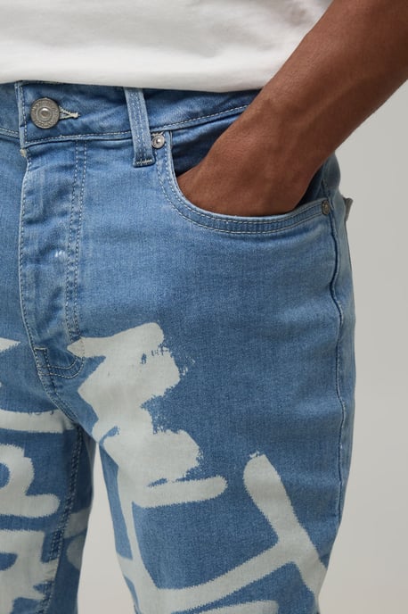 Stacked Graffiti Print Flared Jeans - Image 3