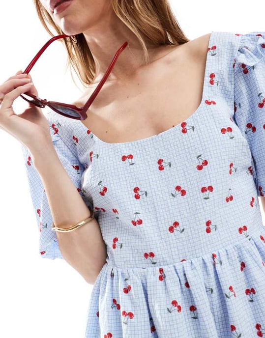 The Frolic exclusive seersucker ruffle puff sleeve shirred babydoll mini dress in blue check and cherry print - Image 4