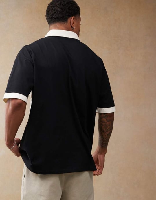 ASOS DESIGN oversized polo med sömsydda paneler och sportsgrafik i svart - Image 3