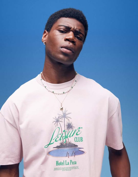 ASOS DESIGN tung boxy oversized t-shirt med palmträdstryck på bröstet i tvättad rosa - Image 1