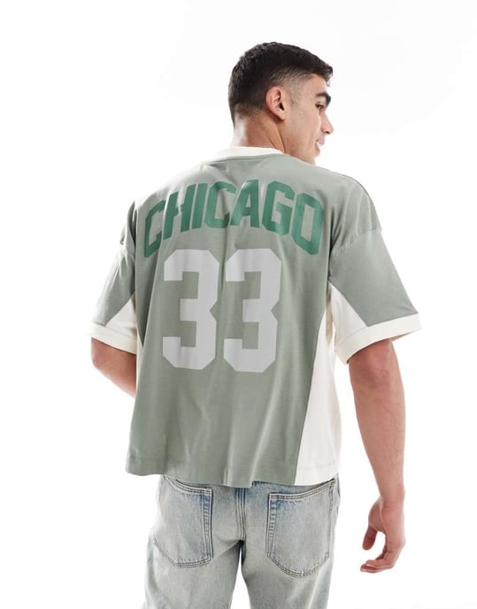 ASOS DESIGN boxig oversized t-shirt med sänkt axel och skurna och sydda paneler samt sportgrafik i grön - Image 2