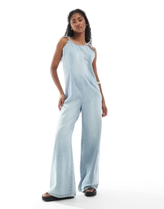 Monki lightweight denim halter neck jumpsuit in blue wash - Image 1