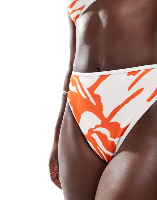 ASOS DESIGN contrast binding high leg high waist bikini bottom in abstract orange - Image 2