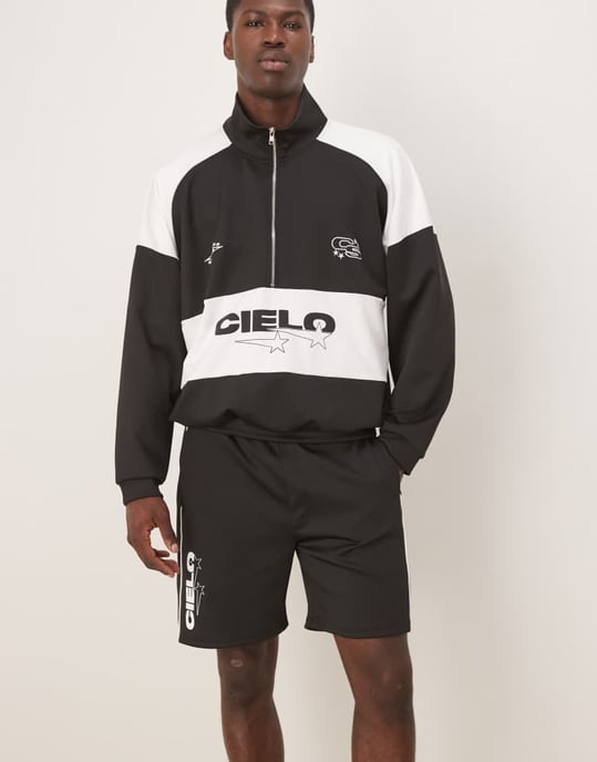 ASOS DESIGN oversized scuba-liknande tygshorts med tryck i svart co ord - Image 2