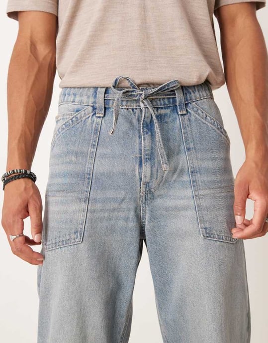 ASOS DESIGN baggy jeans med dragkedja i ljus tvättad blå med nyans - Image 4