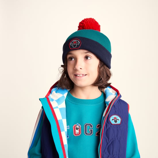 Beulah Shaun the Sheep Kids Knitted Beanie Pom Pom Hat - Peacock Green/Night Blue - Image 1