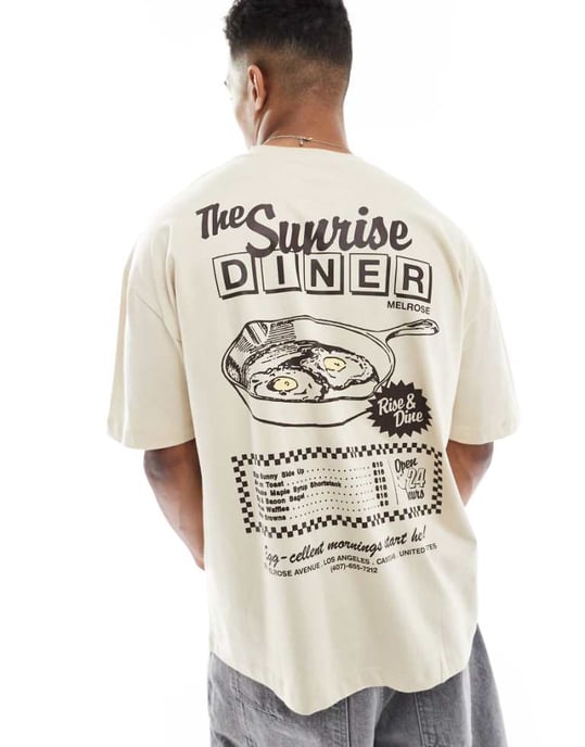 ASOS DESIGN oversize t-shirt med tecknad grafik i beige - Image 1