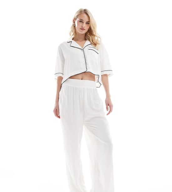 ASOS DESIGN Tall super soft slinky wide leg pyjama trouser in white with contrast binding - Image 1