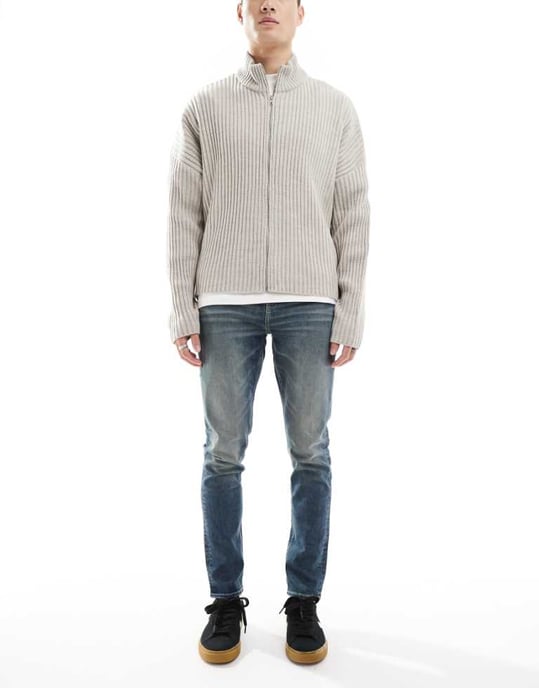 ASOS DESIGN skinny jeans with green tint in light wash blue - Image 1