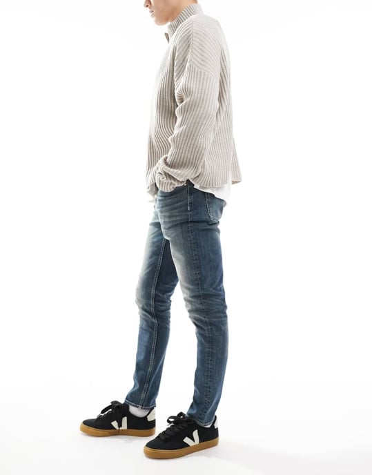ASOS DESIGN skinny jeans with green tint in light wash blue - Image 2