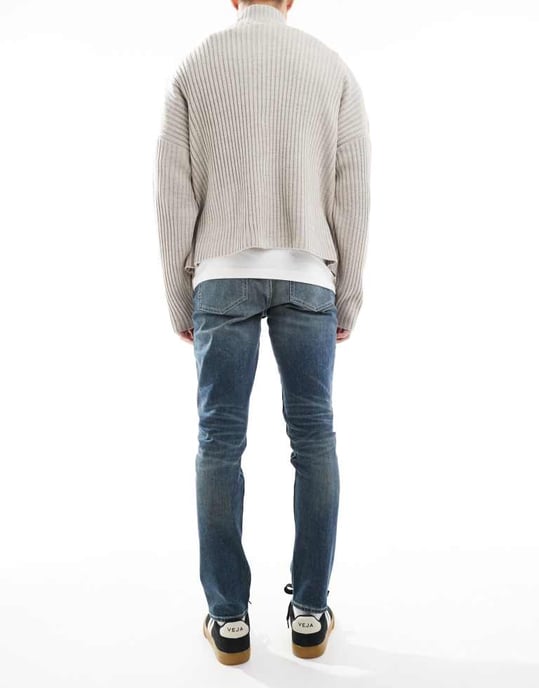 ASOS DESIGN skinny jeans with green tint in light wash blue - Image 3