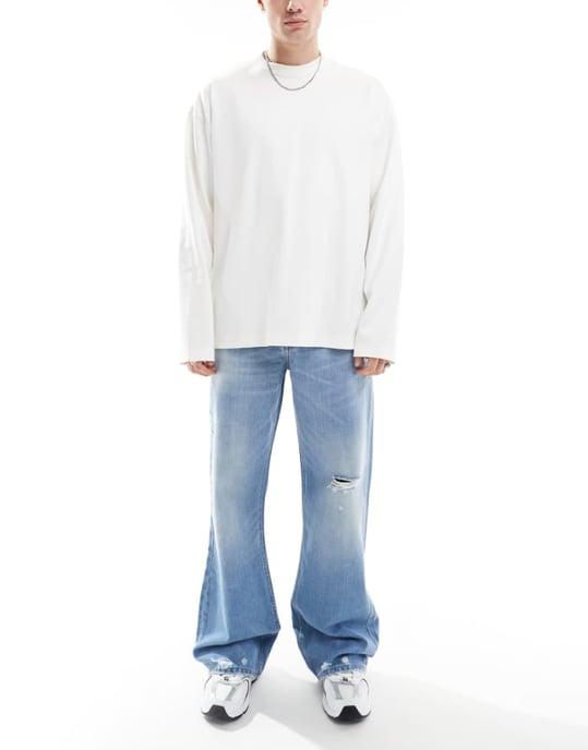 ASOS DESIGN wide flare jeans with tint & rips in mid wash blue - Image 1