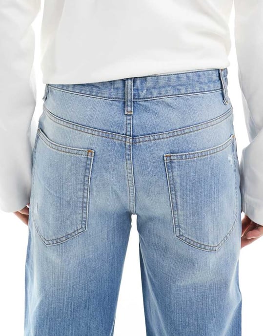 ASOS DESIGN wide flare jeans with tint & rips in mid wash blue - Image 4