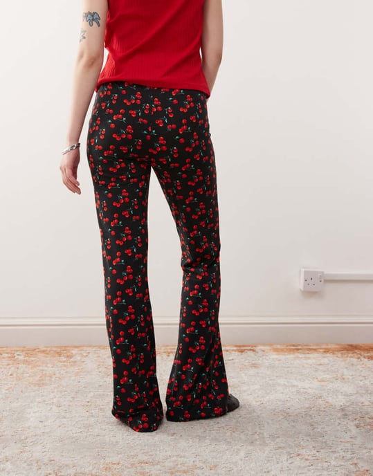 Noisy May Petite flare trouser in cherry print - BLACK - Image 1