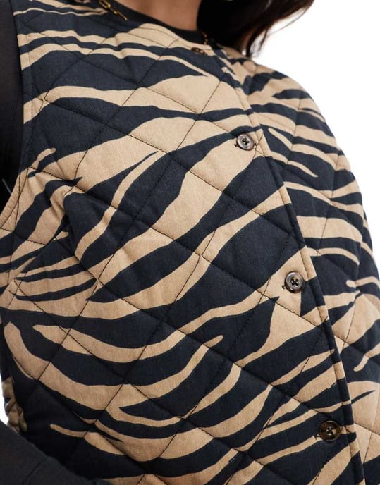 ASOS DESIGN button through quilted vest in animal print - Image 4