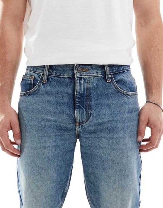 ASOS DESIGN tapered fit jeans in tinted dark wash blue - Image 4