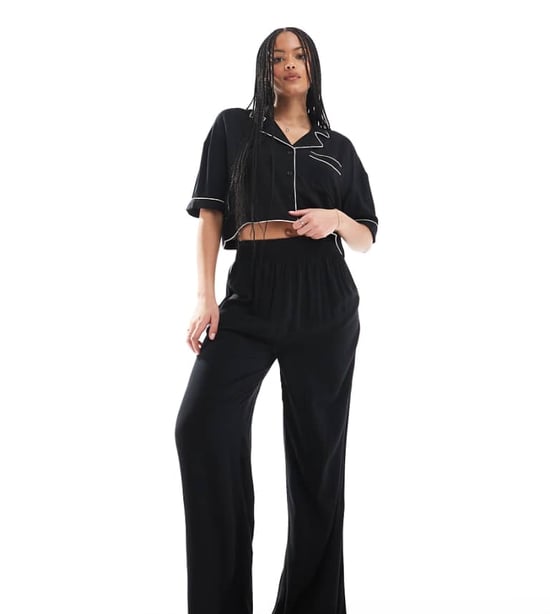 ASOS DESIGN Tall super soft slinky wide leg pyjama trouser in black with contrast binding - Image 1